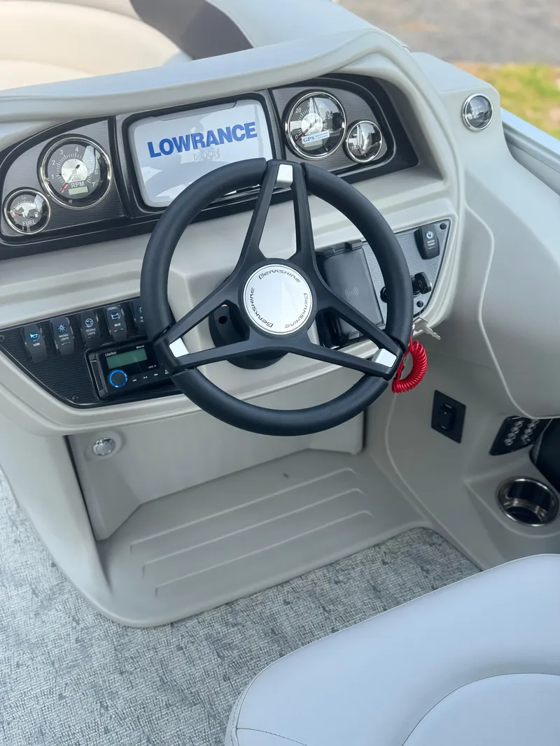 Slide: The Image of Steering console of 2025 Berkshire 22RFX LE boat with Lowrance navigation system. - 10