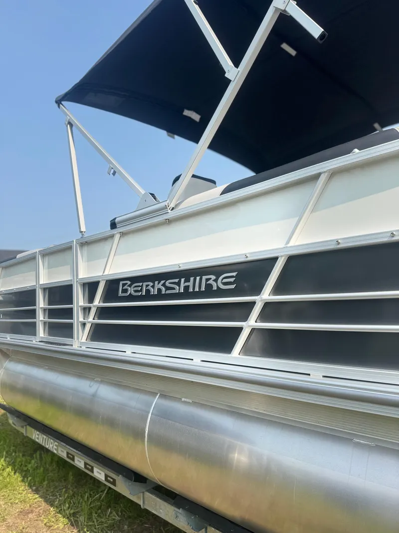 Slide: The Image of 2025 Berkshire 22RFX LE pontoon boat with canopy, side view. - 4