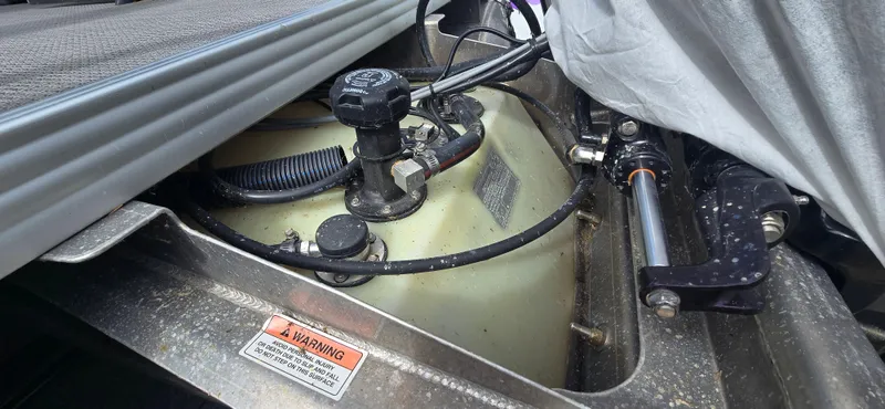 Slide: The Image of Engine compartment of a 2021 Crest Classic LX 220 SLC boat, showing mechanical components. - 17