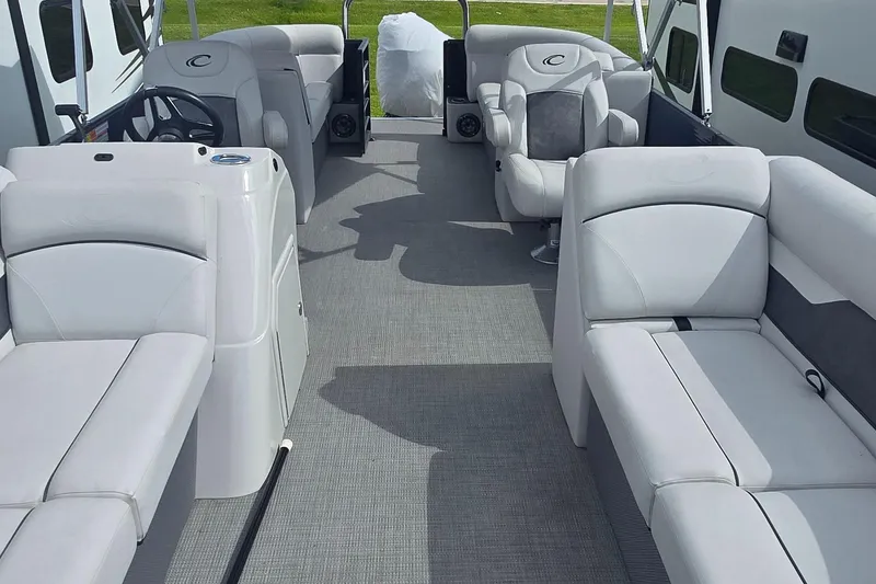 Slide: The Image of 2021 Crest Classic LX 220 SLC pontoon boat interior with plush seating and modern design. - 7