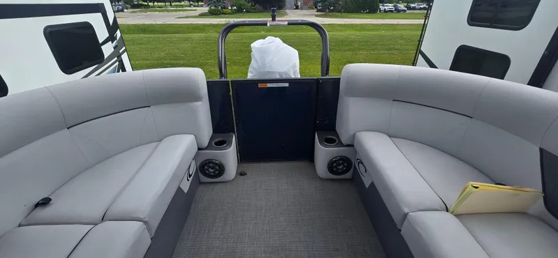 Slide: The Image of 2021 Crest Classic LX 220 SLC boat interior with gray seating and speakers. - 9