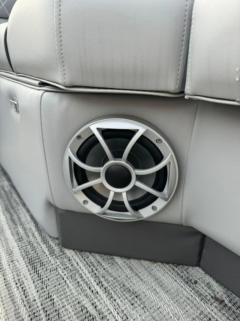 Slide: The Image of 2024 Ranger Reata 220C boat speaker in gray interior. - 5