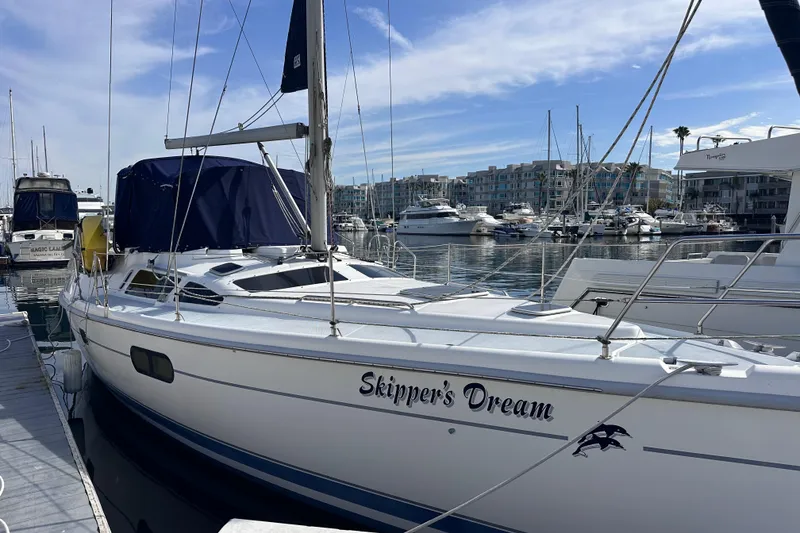 The Image of Hunter Passage 420 sailboat named "Skipper's Dream" docked in a marina, 2000 model. - 0