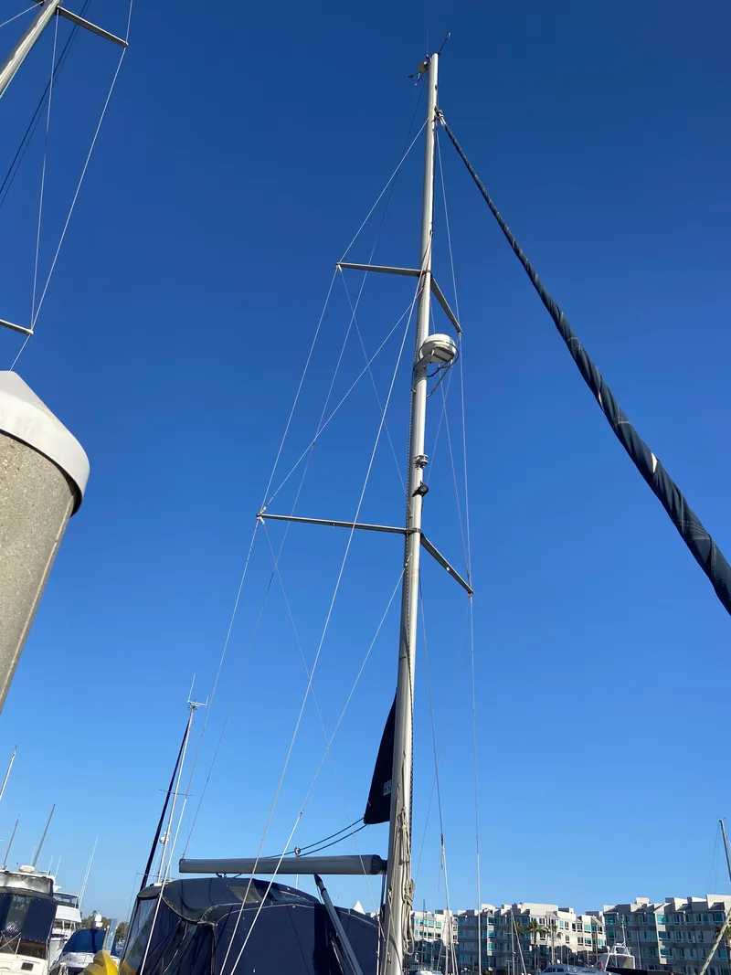 Slide: The Image of Sailboat mast of a 2000 Hunter Passage 420 against a clear blue sky. - 2