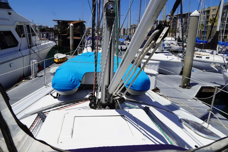 Slide: The Image of Hunter Passage 420 sailboat, 2000 model, docked in a marina with blue covers. - 5