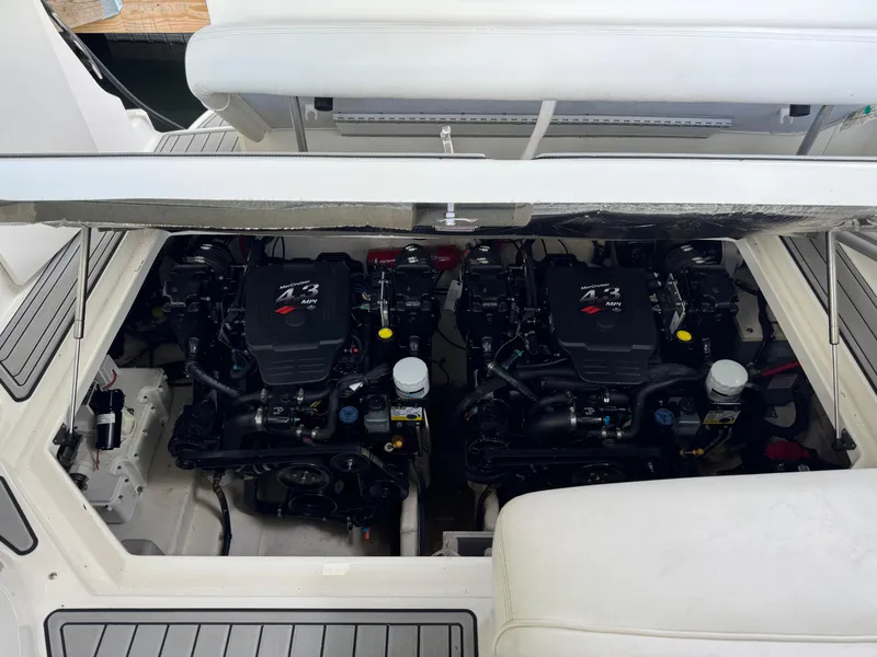Slide: The Image of Twin engines of a 2006 Sea Ray 280 Sundancer boat, showcasing the engine compartment. - 15