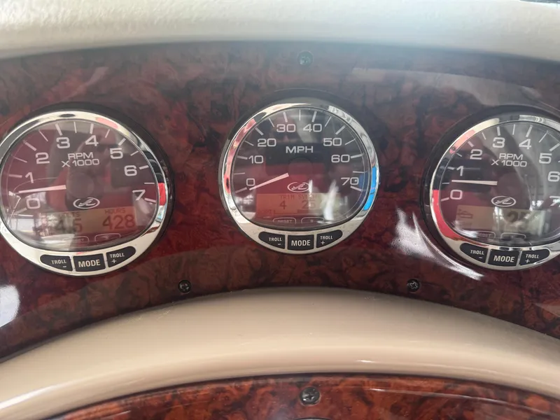 Slide: The Image of Dashboard gauges of a 2006 Sea Ray 280 Sundancer boat. - 7