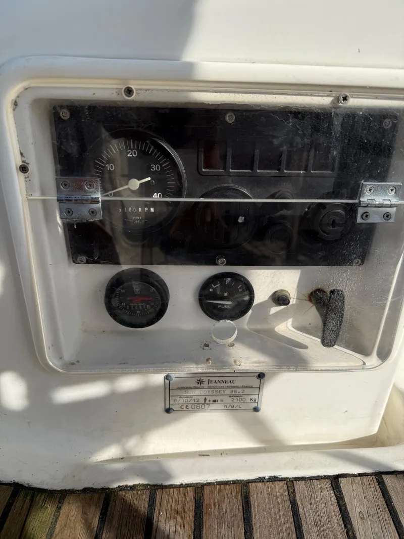 Slide: The Image of Control panel of 2000 Jeanneau Sun Odyssey 36.2 sailboat with gauges and switches. - 10