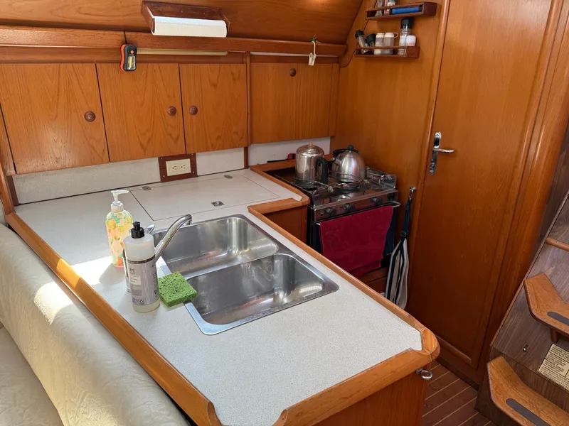 Slide: The Image of Interior of 2000 Jeanneau Sun Odyssey 36.2 yacht kitchen with sink and stove. - 17