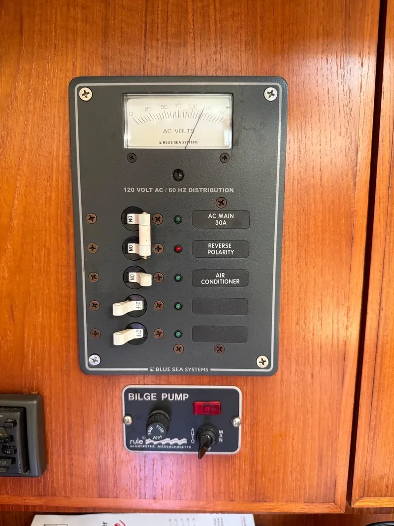Slide: The Image of Electrical panel and bilge pump controls on a 2000 Jeanneau Sun Odyssey 36.2 sailboat. - 20