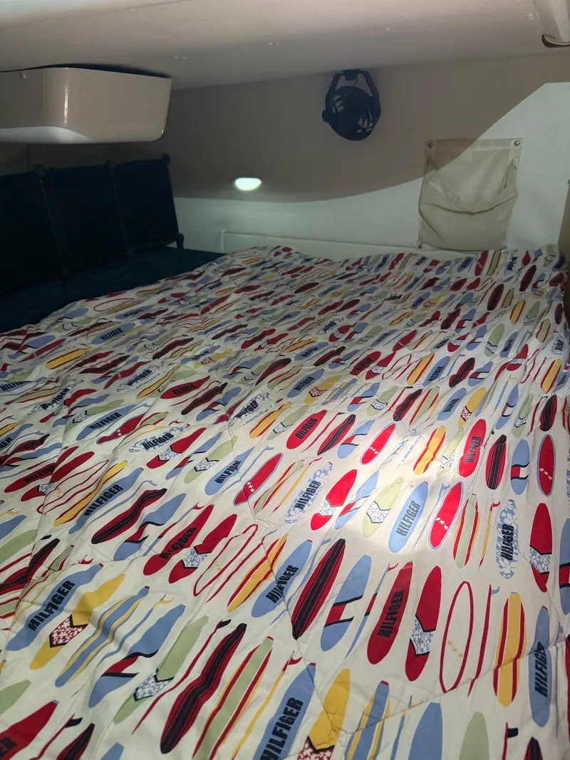 Slide: The Image of Cozy cabin interior of 2000 Jeanneau Sun Odyssey 36.2 with colorful bedding. - 28