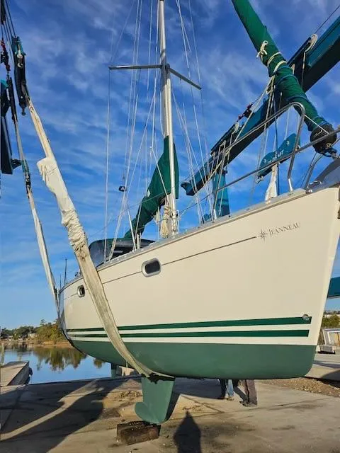 Slide: The Image of Jeanneau Sun Odyssey 36.2 sailboat from 2000 in dry dock, blue sky background. - 35
