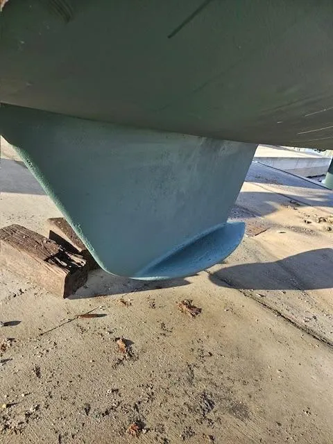 Slide: The Image of Keel of a 2000 Jeanneau Sun Odyssey 36.2 sailboat on dry dock. - 36