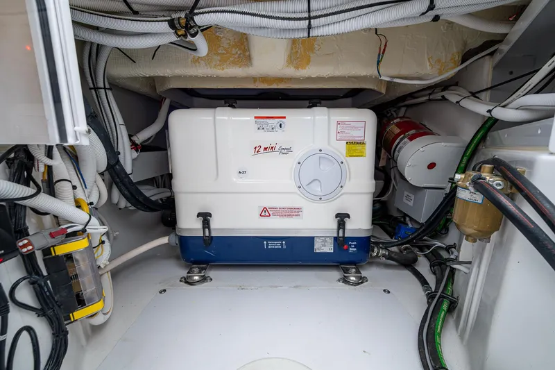 Slide: The Image of Engine room of 2025 HCB 48 Campeon boat, featuring mechanical equipment and wiring. - 30