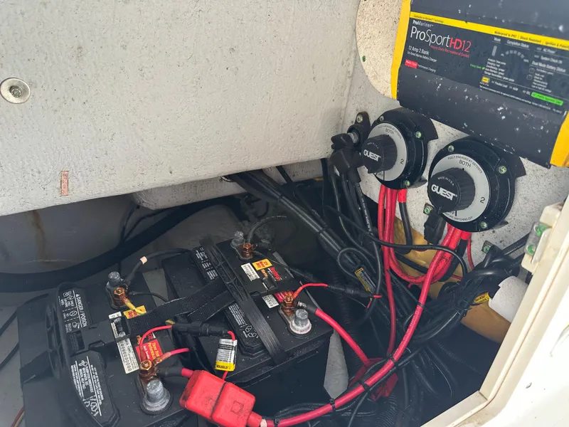 Slide: The Image of Battery compartment of 2003 Cobia 254 Center Console with ProSport HD12 charger. - 16