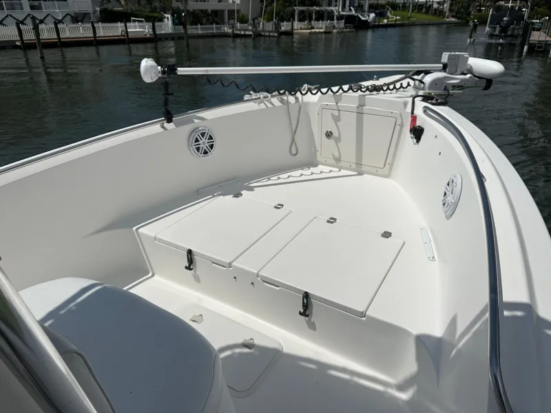 Slide: The Image of 2003 Cobia 254 Center Console boat with twin Yamahas and Rhodan, docked in a marina. - 6