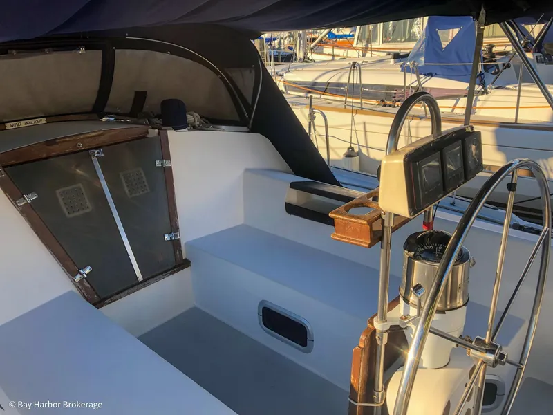 Slide: The Image of Cockpit of a 1992 Catalina 42 sailboat with steering wheel and navigation instruments. - 10