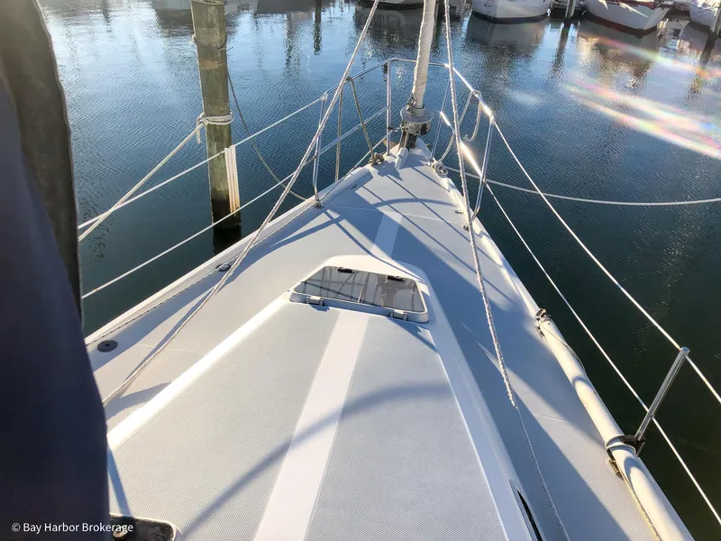 Slide: The Image of Deck view of a 1992 Catalina 42 sailboat docked at a marina. - 16