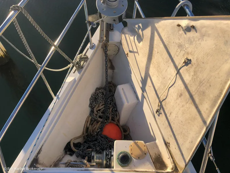 Slide: The Image of Anchor locker of a 1992 Catalina 42 sailboat with chain and buoy. - 19