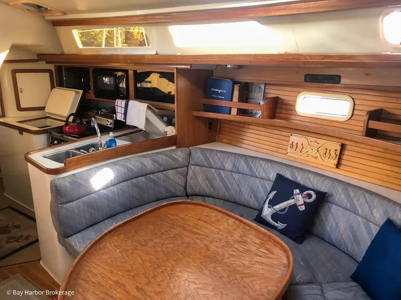 Slide: The Image of Interior of 1992 Catalina 42 sailboat with cozy seating and nautical decor. - 21