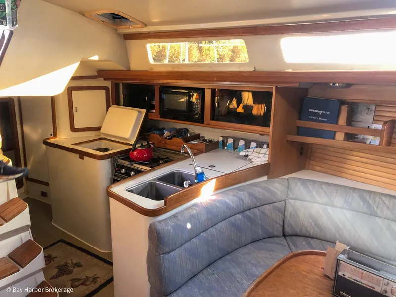 Slide: The Image of Interior of 1992 Catalina 42 sailboat with kitchen and seating area. - 24