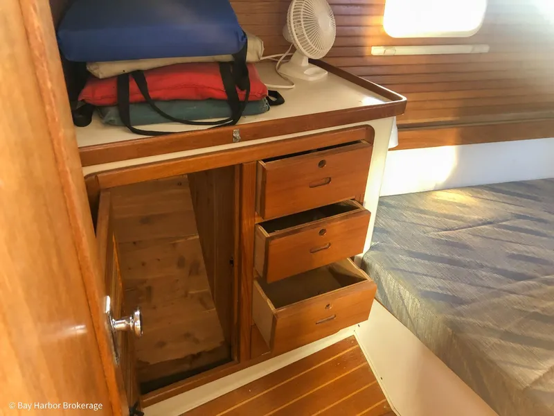 Slide: The Image of Interior of 1992 Catalina 42 sailboat with wooden drawers and bed. - 36