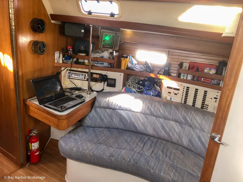 Slide: The Image of Interior of 1992 Catalina 42 sailboat with navigation station and seating area. - 40