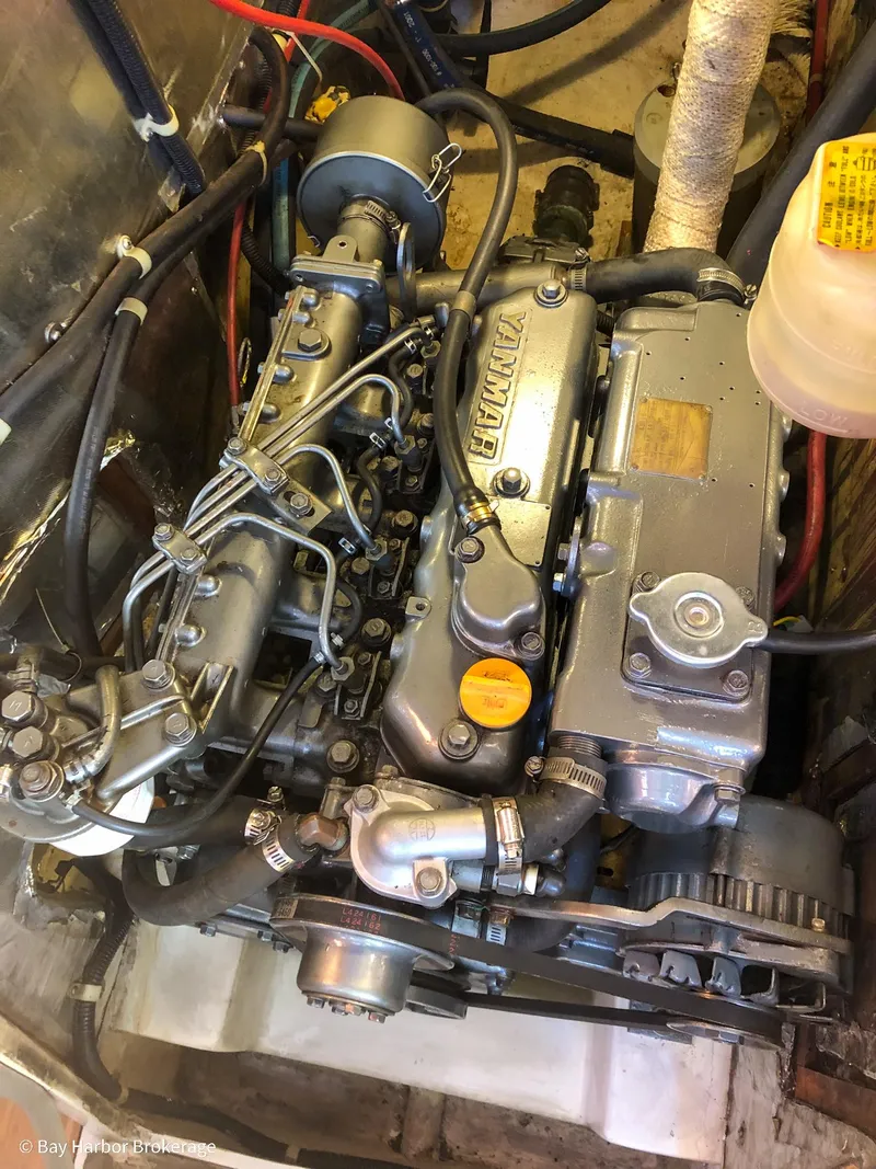 Slide: The Image of Engine of a 1992 Catalina 42 sailboat, showcasing intricate mechanical components. - 43