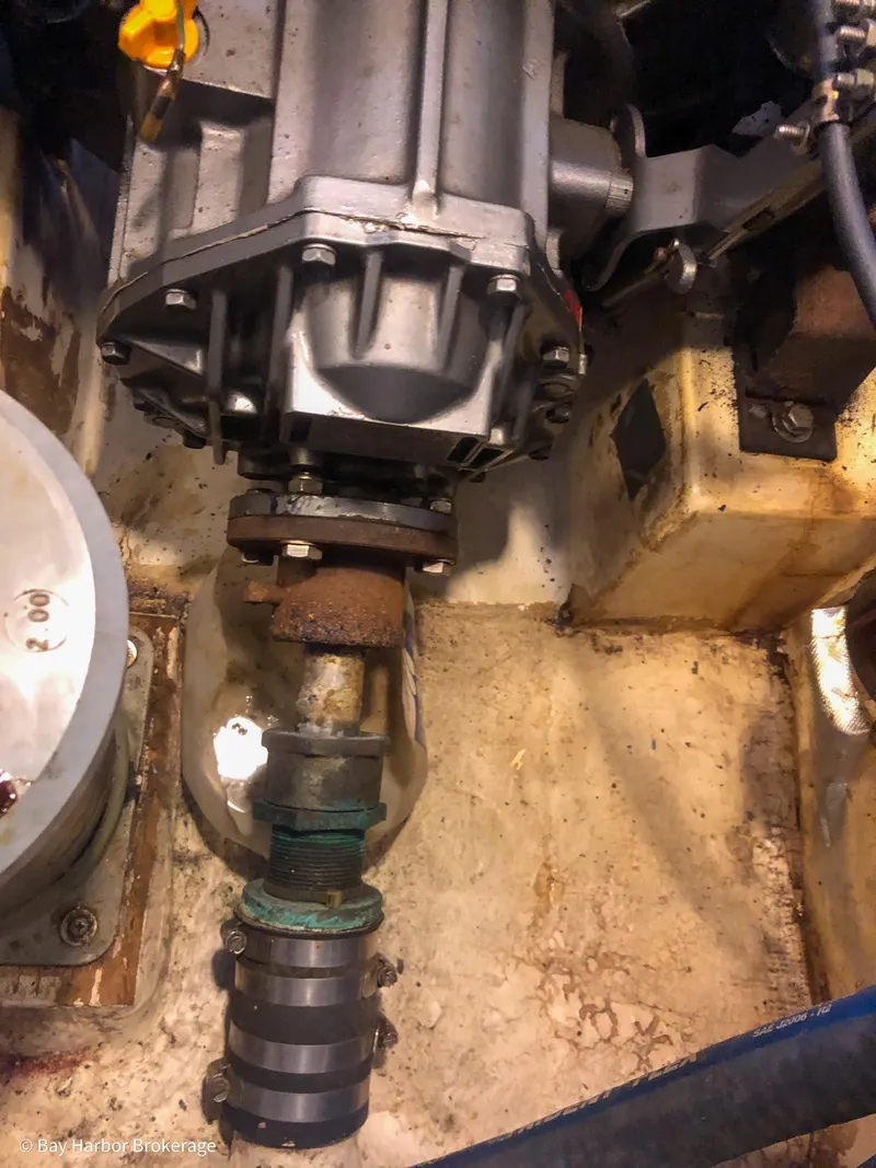 Slide: The Image of Engine compartment of a 1992 Catalina 42 sailboat, showing mechanical components and connections. - 45