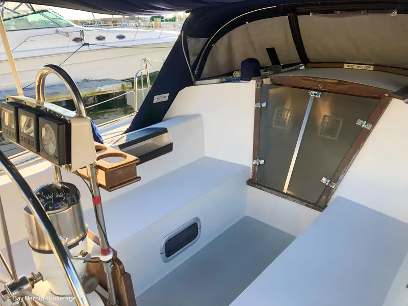 Slide: The Image of Cockpit of a 1992 Catalina 42 sailboat with steering wheel and seating. - 8