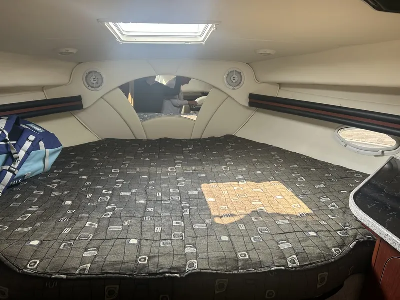 Slide: The Image of 2002 Rinker 342 Fiesta Vee cabin interior with bed and skylight. - 14