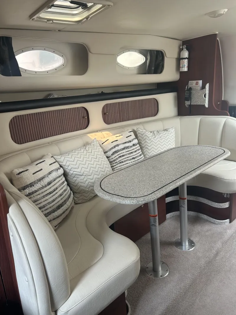 Slide: The Image of Interior of 2002 Rinker 342 Fiesta Vee with plush seating and modern decor. - 16