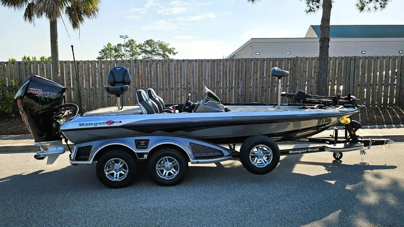 The Image of 2025 Ranger Z519R Cup-Equipped boat on trailer, parked outdoors. - 0