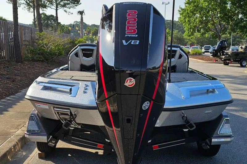 Slide: The Image of 2025 Ranger Z519R Cup-Equipped boat with powerful Mercury V8 engine, parked outdoors. - 3