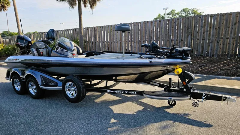 Slide: The Image of 2025 Ranger Z519R Cup-Equipped boat on trailer, parked outdoors. - 4