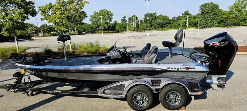 Slide: The Image of 2025 Ranger Z519R Cup-Equipped boat in parking lot, side view. - 7