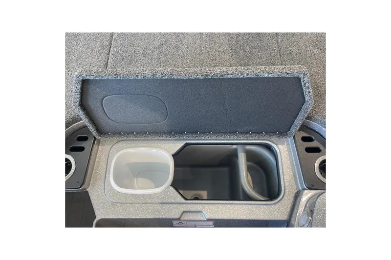 Slide: The Image of 2024 Nitro Z18 boat storage compartment with open lid and cup holders. - 11