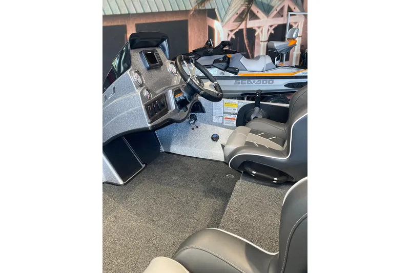 Slide: The Image of Interior of 2024 Nitro Z18 boat with steering wheel and seats. - 3