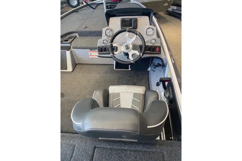 Slide: The Image of 2024 Nitro Z18 boat cockpit with steering wheel and dashboard controls. - 4