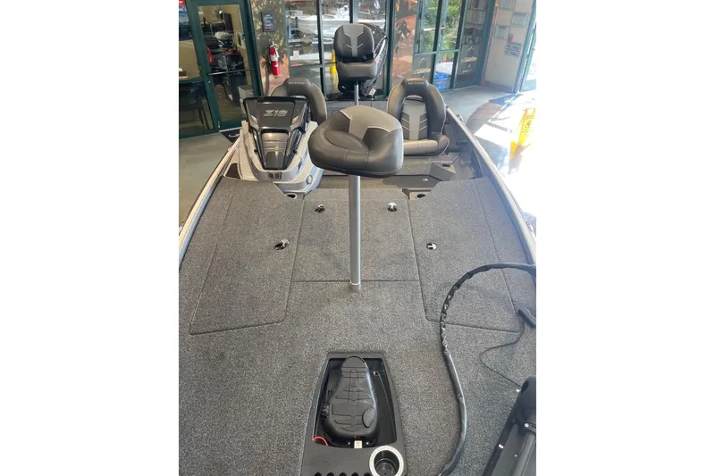 Slide: The Image of 2024 Nitro Z18 boat interior with seating and storage compartments. - 5