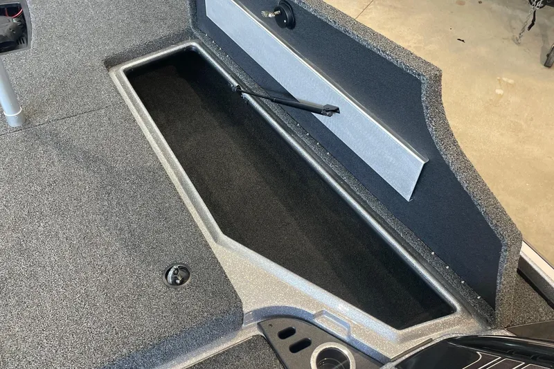 Slide: The Image of 2024 Nitro Z18 boat storage compartment with open lid, showcasing interior space. - 6
