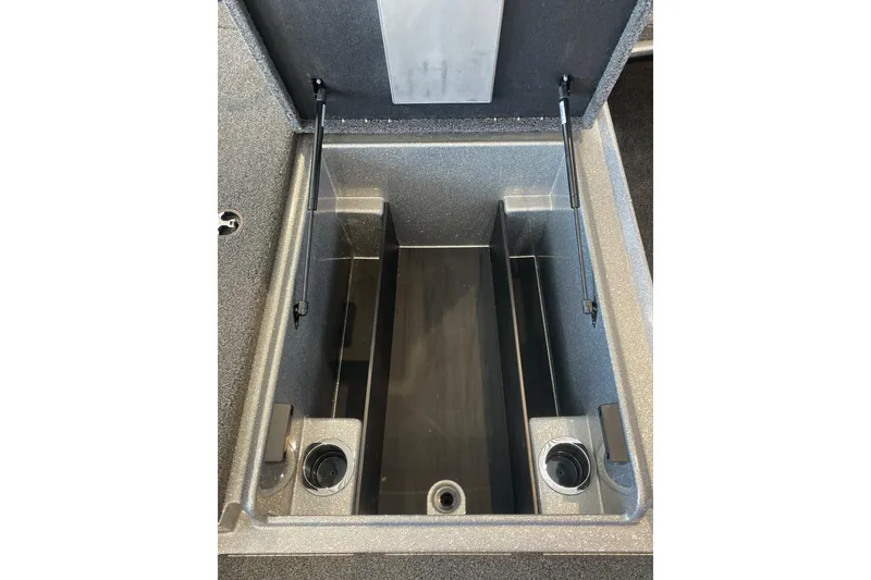 Slide: The Image of 2024 Nitro Z18 boat storage compartment with open lid and hydraulic supports. - 7