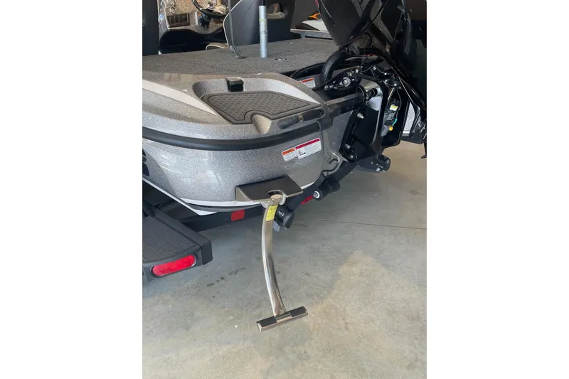 Slide: The Image of 2024 Nitro Z18 boat rear view with motor and step ladder. - 8