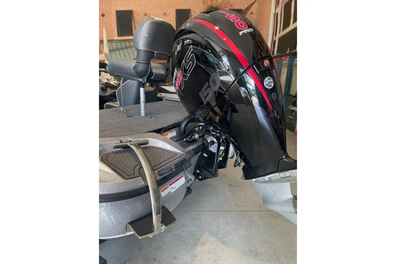 Slide: The Image of 2024 Nitro Z18 boat with powerful outboard motor, sleek design, and comfortable seating. - 9