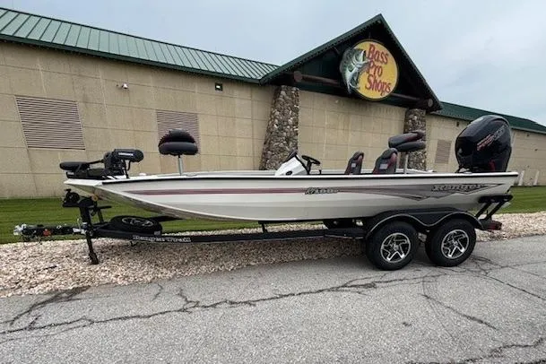 The Image of 2025 Ranger RT198P fishing boat on trailer, side view, outdoors. - 0