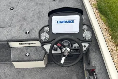 Slide: The Image of 2025 Ranger RT198P fishing boat deck with Lowrance electronics and swivel seat. - 2