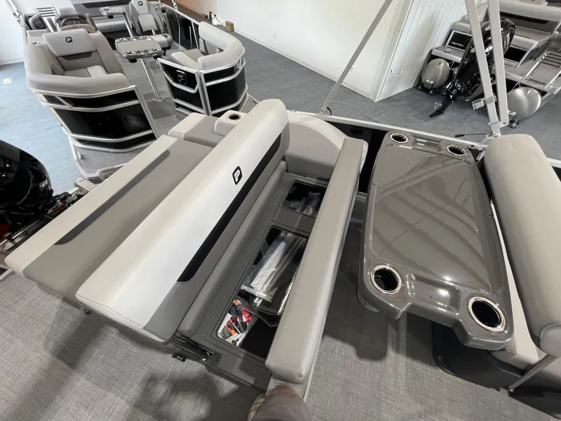 Slide: The Image of 2025 Princecraft Vectra 21 RL pontoon boat interior with seating and storage compartments. - 12