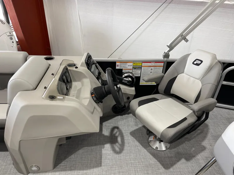Slide: The Image of 2025 Princecraft Vectra 21 RL boat interior with steering console and captain's chair. - 14