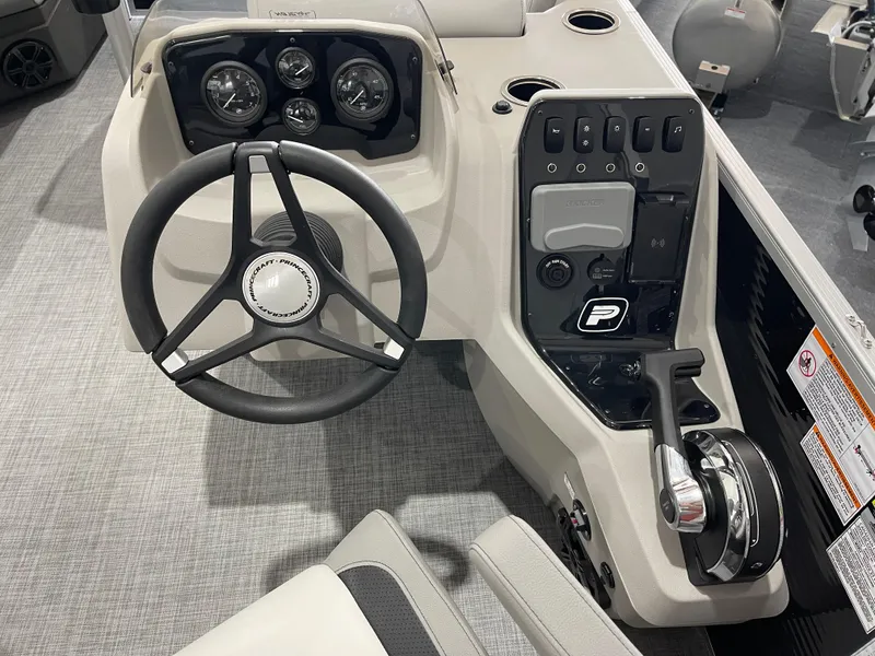 Slide: The Image of 2025 Princecraft Vectra 21 RL boat dashboard with steering wheel and control panel. - 15