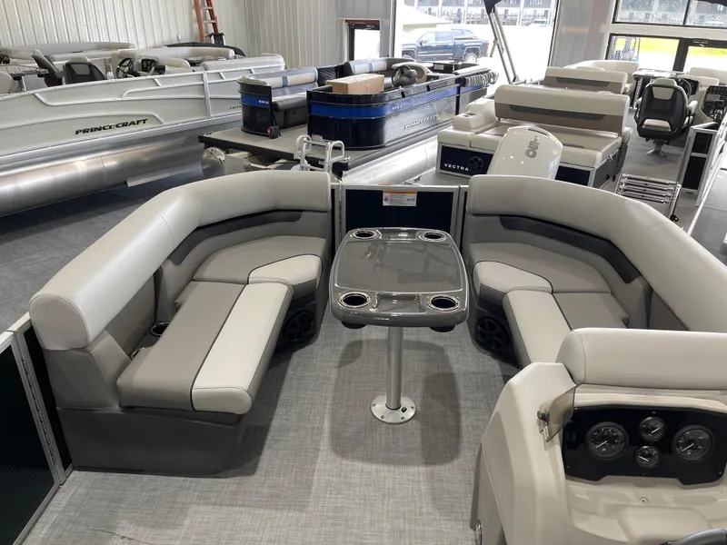 Slide: The Image of 2025 Princecraft Vectra 21 RL pontoon boat interior with gray seating and table. - 16